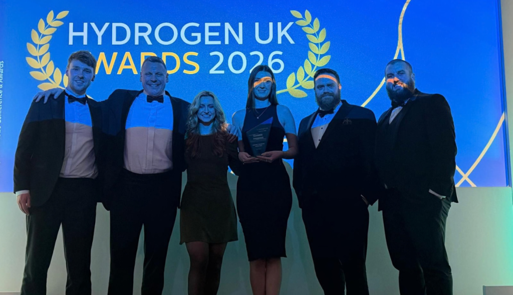 An on-stage image of IACS and Hydrogen Safe teams after receiving the award.