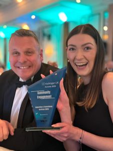 An image of James Baker, Operations Manager at IACS, and Grace Coffield, Administrative Assistant at IACS, pictured with their award.